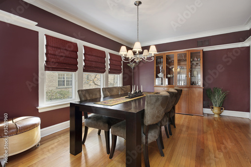 Dining room with maroon walls © pics721