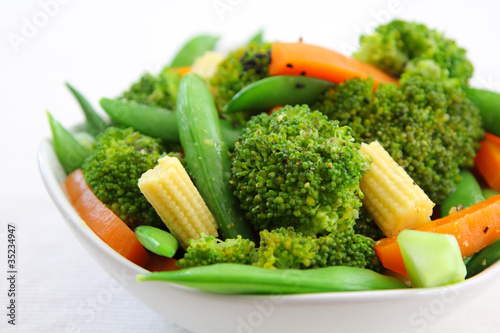 Broccoli salad with carrot ,baby corn and snap pea photo
