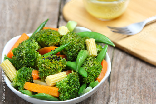 Broccoli salad with carrot ,baby corn and snap pea photo