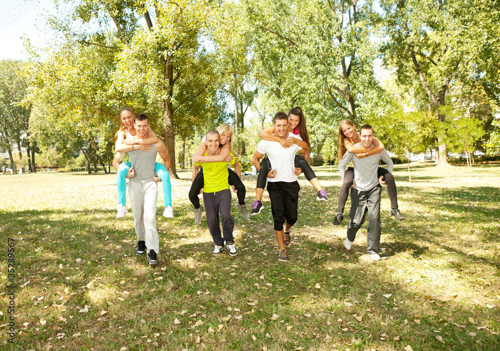 four couple having fun in the park four couple having fun in the park