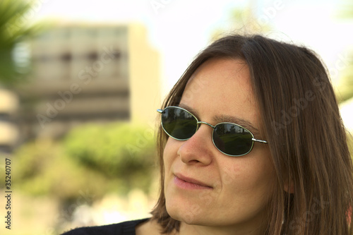 Portrait of a young woman in sunglasses