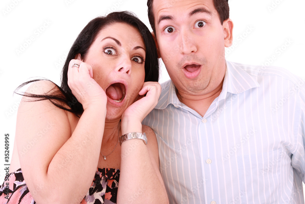 young adult couple in cinema movie theater scared while watching young adult couple in cinema movie theater scared while watching