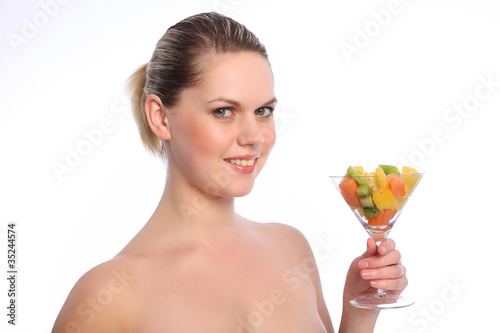 Healthy mixed fruit cocktail for young woman
