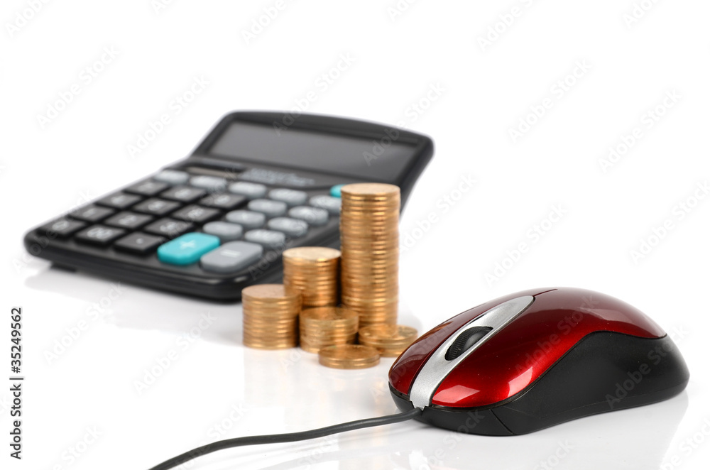 Computer mouse, calculator and coins Computer mouse, calculator and coins