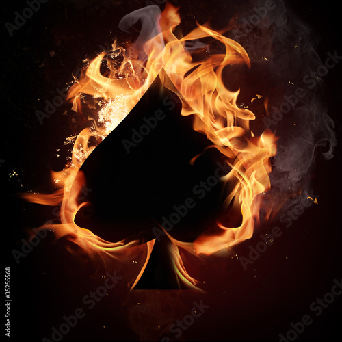 Card symbol spade, covered in flames. Fototapet