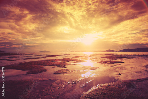 Tropical sunset on the beach. © Cozyta