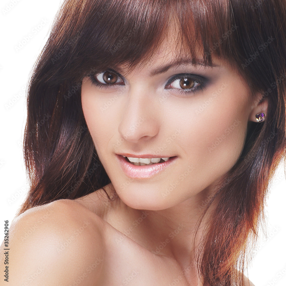 Obraz premium Portrait of a young brunette in a beautiful makeup
