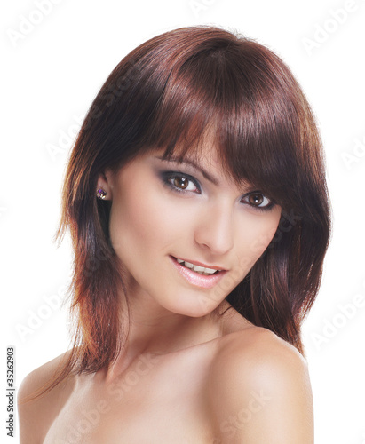 Portrait of a young brunette in a beautiful makeup