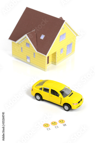 Toy car,model house and emoticon