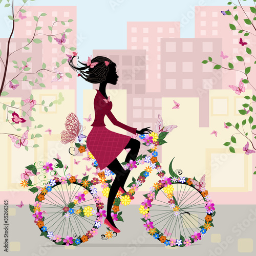 Girl on a bicycle in the city