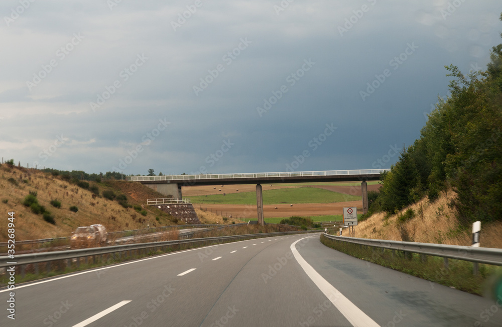 Almost deserted Autobahn under threatening skies Almost deserted Autobahn under threatening skies