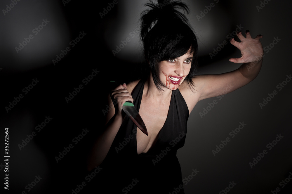 Crazy cannibal woman with blood on her face Stock Photo | Adobe Stock