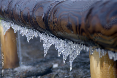 Snow and ice crystals on a guard rail