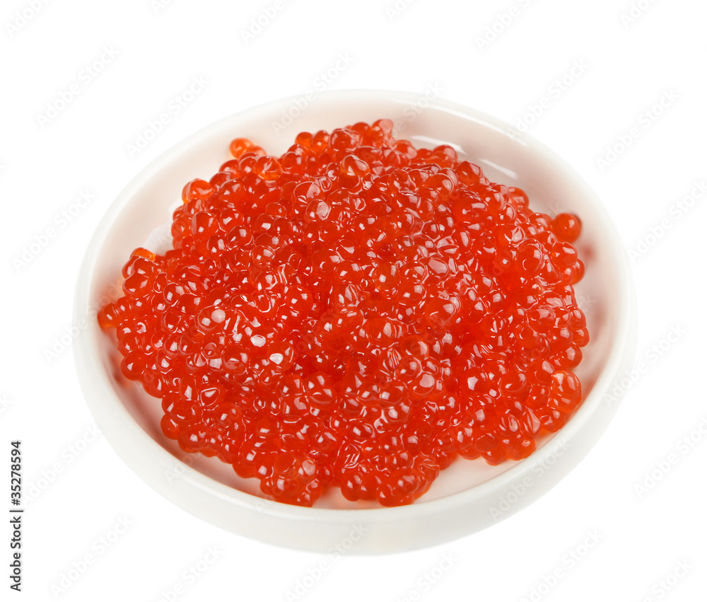 Red caviar on a white saucer Red caviar on a white saucer