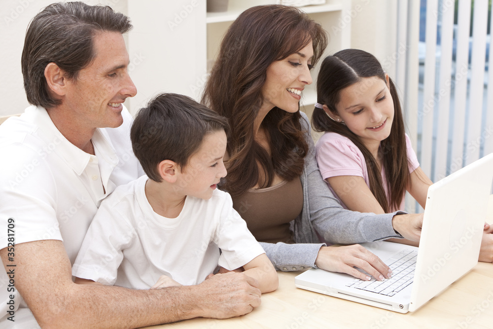 Happy Family Having Fun Using Laptop Computer At Home Happy Family Having Fun Using Laptop Computer At Home