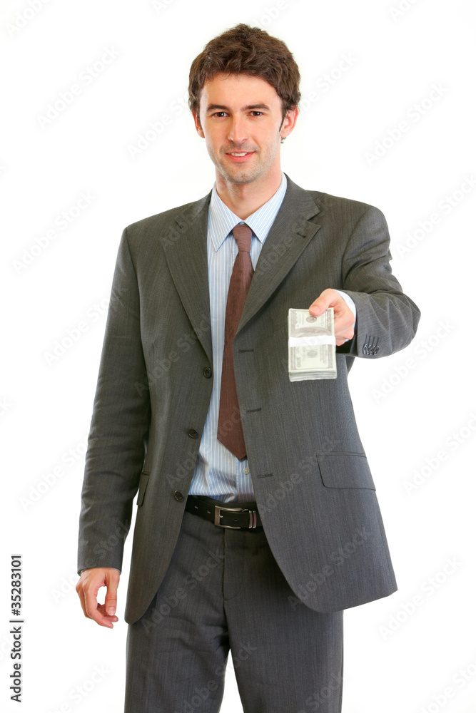 Modern businessman giving stack of dollars Modern businessman giving stack of dollars