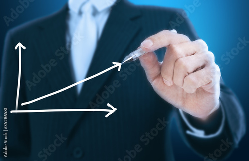 businessman writing graph ,blue background