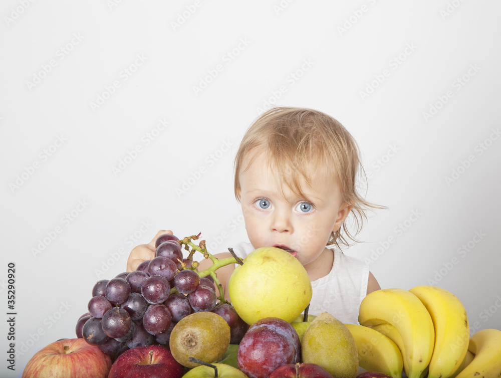 Fototapeta premium blonde girl grabbing fruit