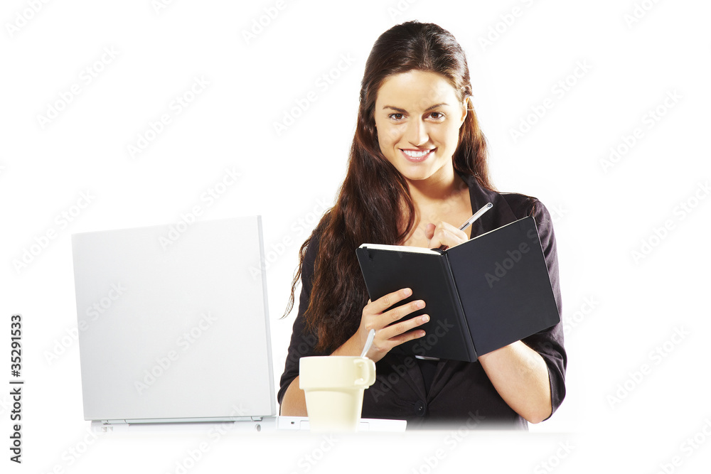 mujer empresaria sonriendo escribiendo en agenda mujer empresaria sonriendo escribiendo en agenda