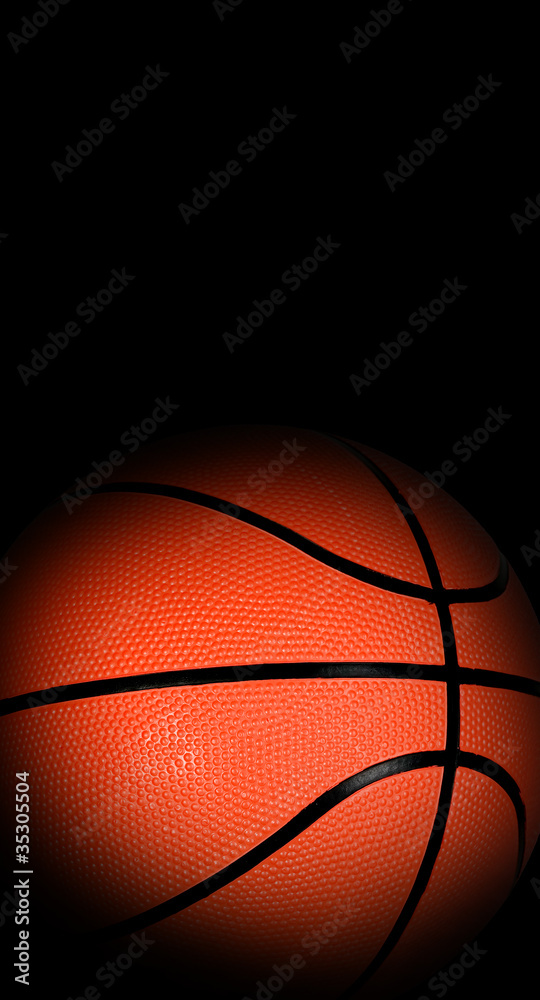 Fototapeta Basketball ball with dark edges on black background