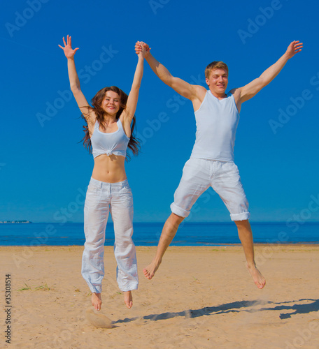 Jumping Couple Seaside