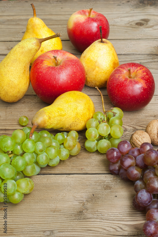 apples grapes and pears, wooden table apples grapes and pears, wooden table
