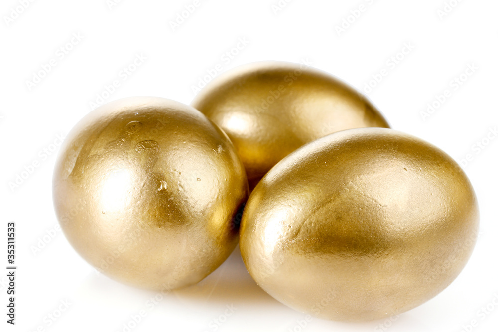 golden eggs isolated on white