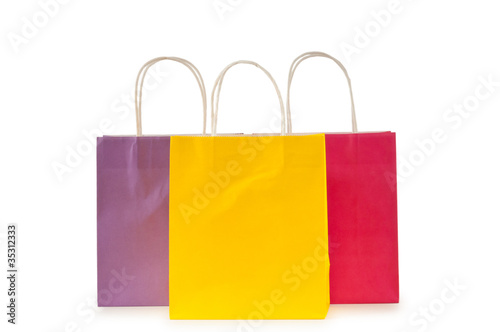 Colourful paper shopping bags isolated on white