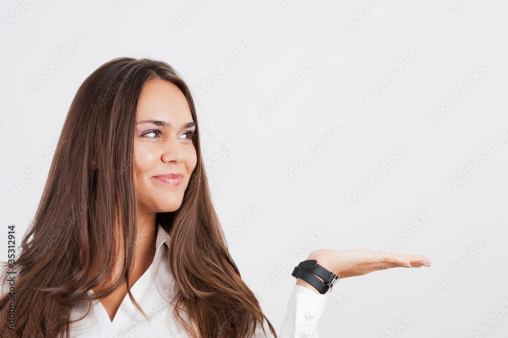 beautiful woman showing something on the palm of her hand. beautiful woman showing something on the palm of her hand.