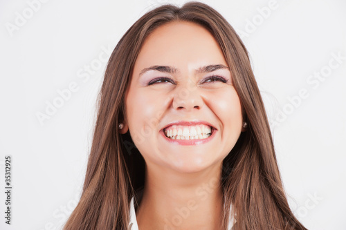 Closeup of beautiful young woman screaming in excitement