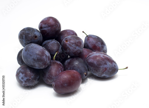 plums on white background