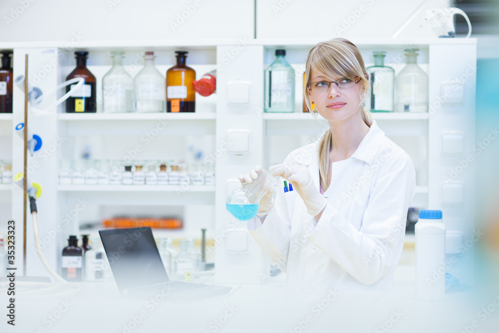 female researcher carrying out research in a lab female researcher carrying out research in a lab