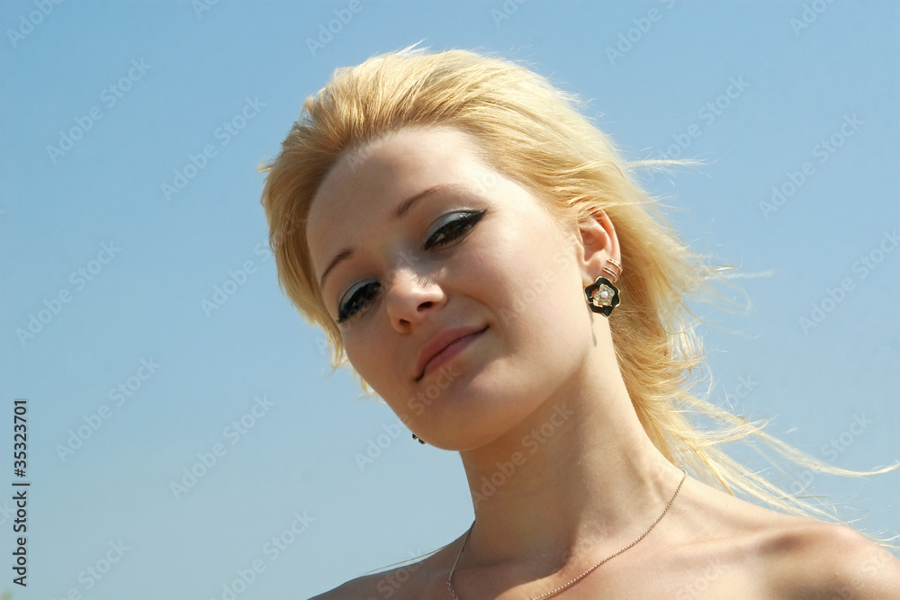 portrait on a background of a blue sky portrait on a background of a blue sky