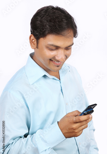 Indian Young Businessman Using a Cell Phone