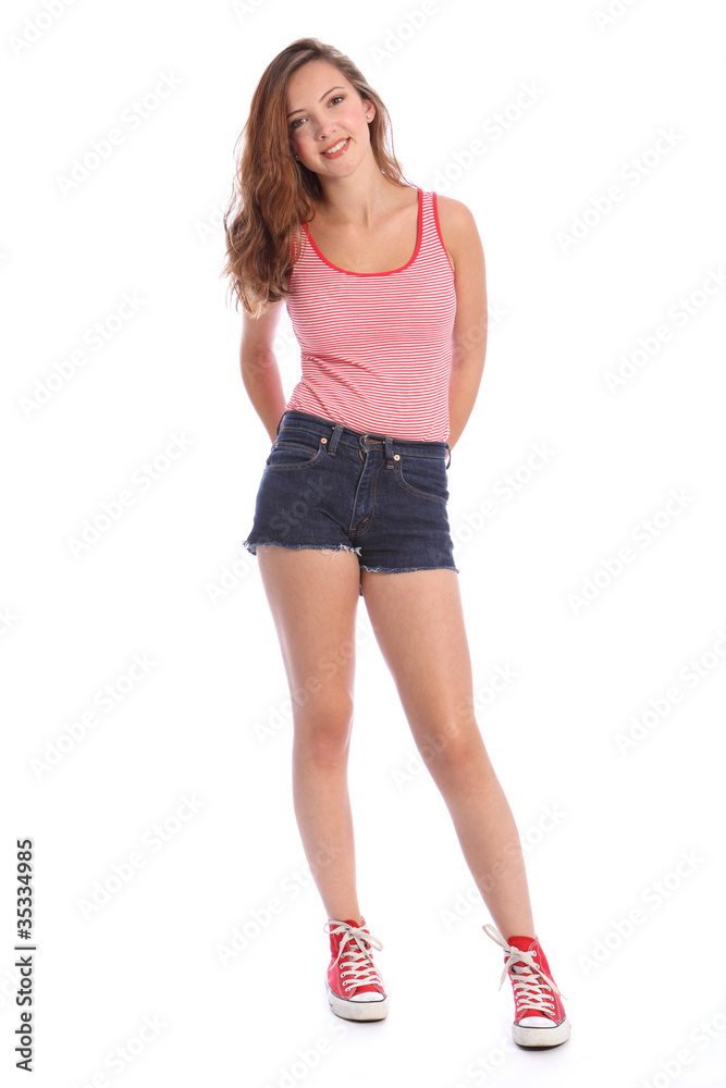 Teenager girl in denim shorts and vest happy smile Photos | Adobe Stock