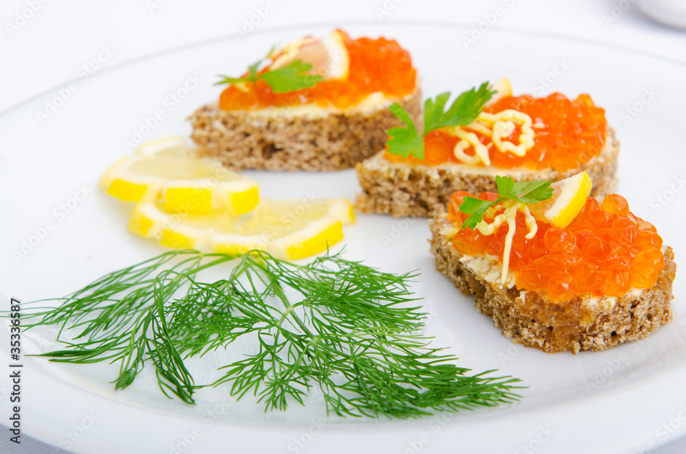Red caviar served on bread Red caviar served on bread