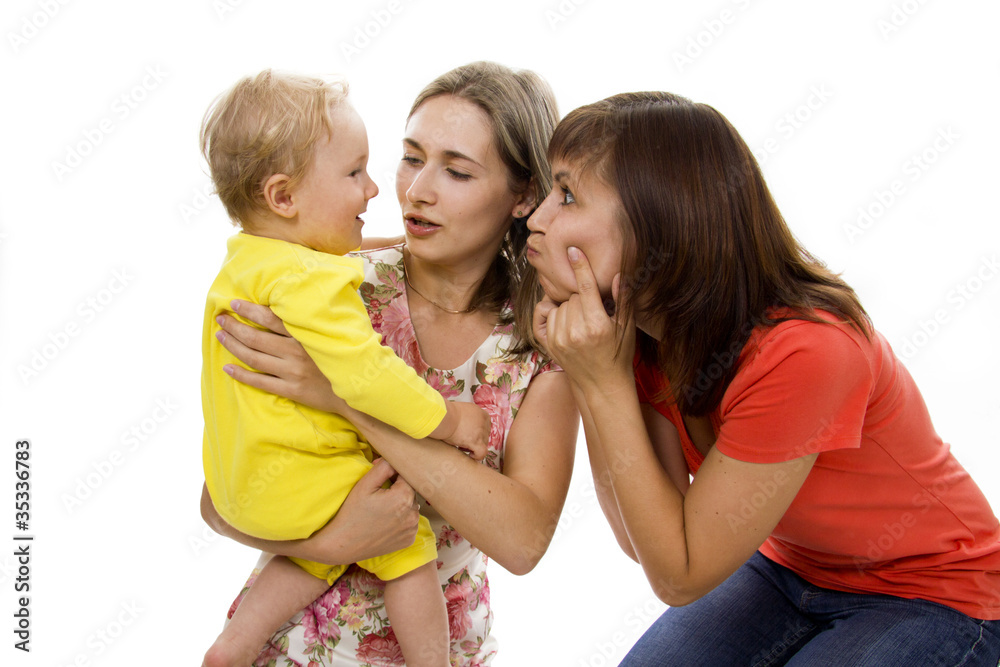 Mother and the aunt have fun together with the child Mother and the aunt have fun together with the child