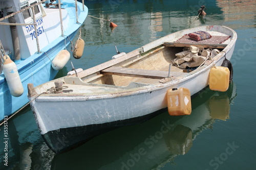 Fishing boat tied to the pier, Jaffa Port, Israel © Rubi Halfon