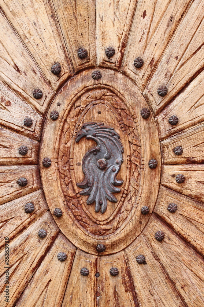 Wooded door with emblem Wooded door with emblem