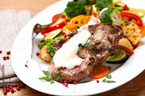 Pork steak with pan-cooked vegetables and cream sauce