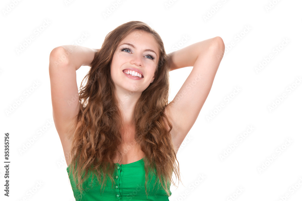 portrait of attractive smile teenage girl with hands behind head portrait of attractive smile teenage girl with hands behind head