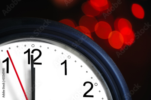 Office clock about to show midnight - few seconds to New Year