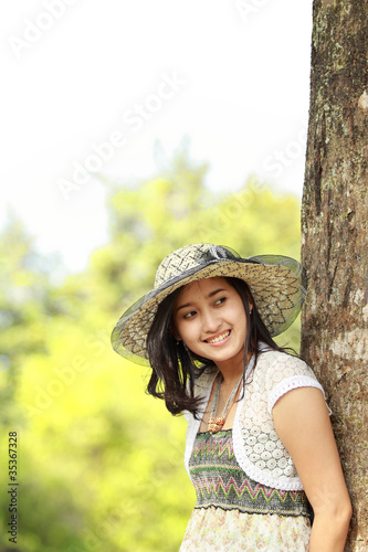 happy asian girl smiling in the park