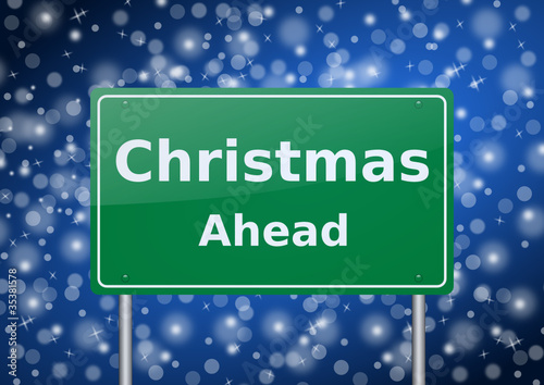 christmas ahead traffic sign on snowing background