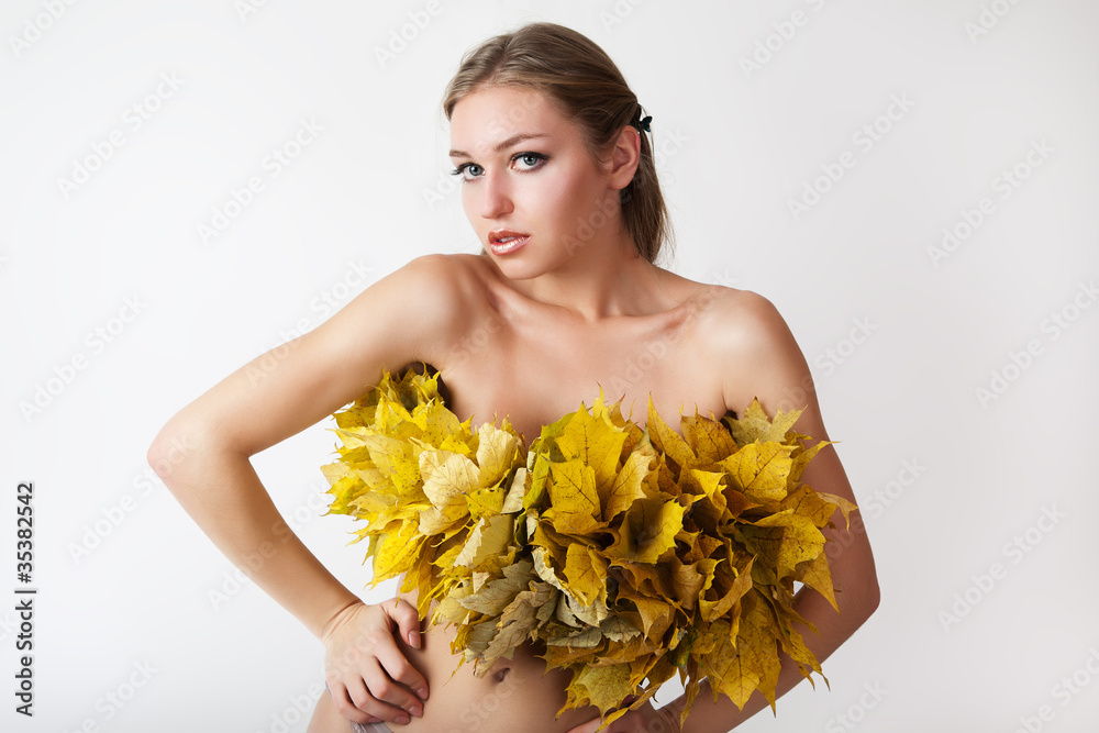 A girl with a wreath of autumn leaves.
