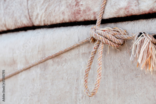nomad yurt detail - thick felt background and rope photo