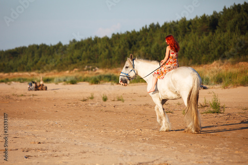 Woman with horse at the beach © Ints