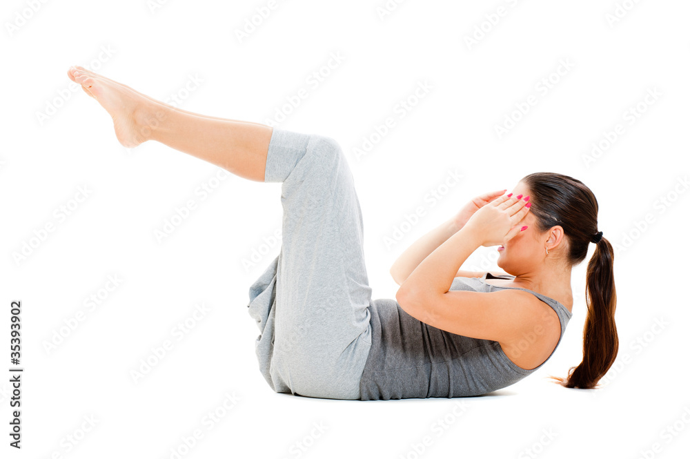 Fototapeta premium woman doing exercises for abdominal muscles
