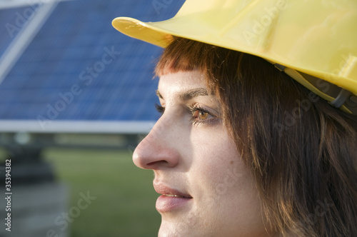 optimistic look of young lady near photo