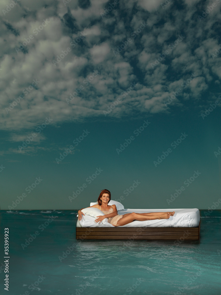 woman in bed on water